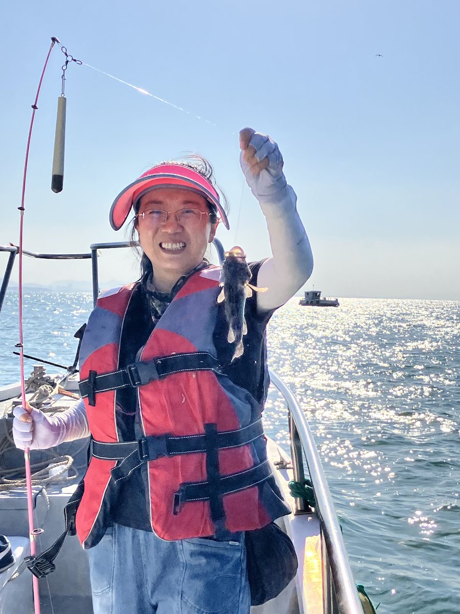 The first black fish of the morning held up on the boat
